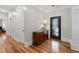 Hallway with hardwood floors, detailed trim, and an ornate front door at 4390 Wicklow Ct, Suwanee, GA 30024
