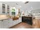 Gourmet kitchen with custom cabinets, a copper sink, and stainless steel appliances at 4390 Wicklow Ct, Suwanee, GA 30024