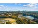Breathtaking aerial view of a park and lake, with the city skyline in the distance at 959 Hall Nw Pl, Atlanta, GA 30318