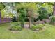 Backyard landscape featuring green plants and a trellis at 959 Hall Nw Pl, Atlanta, GA 30318
