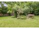 The backyard offers a peaceful retreat with a garden and mature trees at 959 Hall Nw Pl, Atlanta, GA 30318