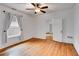 Bright bedroom with hardwood floors, a ceiling fan, and natural lighting from the large window at 959 Hall Nw Pl, Atlanta, GA 30318