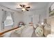 Bedroom featuring soft, natural lighting, fresh decor and a ceiling fan at 959 Hall Nw Pl, Atlanta, GA 30318