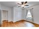 Spacious bedroom featuring hardwood floors, a ceiling fan, closet, and natural lighting at 959 Hall Nw Pl, Atlanta, GA 30318