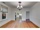 Bright dining room leading into kitchen with stainless steel appliances at 959 Hall Nw Pl, Atlanta, GA 30318