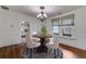 Cozy dining room with round table, chandelier, and natural light at 959 Hall Nw Pl, Atlanta, GA 30318