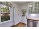 Cozy kitchen detail featuring butcher block countertop and stainless steel dishwasher at 959 Hall Nw Pl, Atlanta, GA 30318