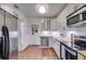 Bright kitchen with white cabinetry, stainless steel appliances, and butcher block countertops at 959 Hall Nw Pl, Atlanta, GA 30318
