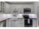 Charming kitchen with white cabinetry, butcher block countertops, and subway tile backsplash at 959 Hall Nw Pl, Atlanta, GA 30318