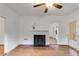 Spacious room featuring hardwood floors, fireplace and fresh white paint at 959 Hall Nw Pl, Atlanta, GA 30318
