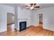 Bright living room with fireplace, hardwood floors, and multiple entrances at 959 Hall Nw Pl, Atlanta, GA 30318