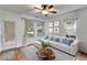 Bright living room featuring hardwood floors, neutral decor, and lots of natural light at 959 Hall Nw Pl, Atlanta, GA 30318