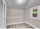 Carpeted room features a window, neutral paint, and a white closet, perfect for storage at 959 Hall Nw Pl, Atlanta, GA 30318