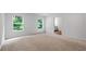 Spacious bedroom featuring two windows and neutral carpeting at 132 2Nd Nw St, Atlanta, GA 30318