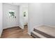 Bright entryway features hardwood floors, a white door, and stairs leading to a cozy space at 132 2Nd Nw St, Atlanta, GA 30318