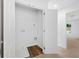 Bright laundry closet featuring wood look flooring and white shelving at 132 2Nd Nw St, Atlanta, GA 30318