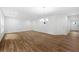 Expansive open-concept living room showcasing hardwood floors and modern lighting fixtures at 132 2Nd Nw St, Atlanta, GA 30318
