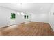 Spacious living room with hardwood floors, neutral paint, and sliding doors to the yard at 132 2Nd Nw St, Atlanta, GA 30318