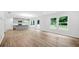 Open concept living space features hardwood floors, a kitchen island, and natural light at 132 2Nd Nw St, Atlanta, GA 30318