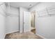 Walk-in closet with shelving and rod system for storage at 132 2Nd Nw St, Atlanta, GA 30318