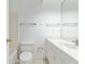 Bright bathroom featuring tile floor, shower and tub combination, and a large vanity mirror at 165 River North Walk, Atlanta, GA 30328