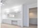 Bright bedroom featuring neutral carpet, and a built-in vanity and mirrors at 165 River North Walk, Atlanta, GA 30328