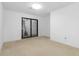 A bright bedroom with a sliding glass door offers great natural light at 165 River North Walk, Atlanta, GA 30328