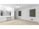 Bright bedroom featuring neutral carpet, natural light, and a built-in vanity and mirrors at 165 River North Walk, Atlanta, GA 30328