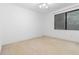 Bright bedroom featuring neutral carpet, natural light, and windows at 165 River North Walk, Atlanta, GA 30328