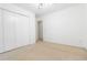 Bright bedroom featuring neutral carpet, natural light, and a closet at 165 River North Walk, Atlanta, GA 30328