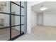 A bright bedroom has neutral carpet and sliding doors to the outside courtyard at 165 River North Walk, Atlanta, GA 30328