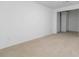A bright bedroom has neutral carpet and a closet is visible in the background at 165 River North Walk, Atlanta, GA 30328