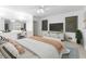 Bright bedroom with neutral carpet, natural light, decor, and a built-in vanity and mirrors at 165 River North Walk, Atlanta, GA 30328