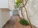 Private courtyard with brick flooring and mature plants at 165 River North Walk, Atlanta, GA 30328