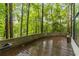 Wood deck with views of the surrounding lush, green trees at 165 River North Walk, Atlanta, GA 30328