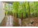 A wood deck offers relaxing views of the trees and surrounding area at 165 River North Walk, Atlanta, GA 30328