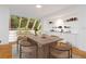 Stylish dining area with a large table, modern chairs, and a view of the outdoors at 165 River North Walk, Atlanta, GA 30328