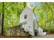 Striking modern exterior featuring a crisp white facade and lush green surroundings at 165 River North Walk, Atlanta, GA 30328