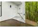 Exterior shot of a wooden deck leading up to a bright white doorway at 165 River North Walk, Atlanta, GA 30328