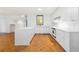 Bright, modern kitchen with white cabinets, a peninsula, and updated appliances at 165 River North Walk, Atlanta, GA 30328