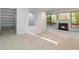Open living space with large windows, fireplace, and built-in shelving at 165 River North Walk, Atlanta, GA 30328