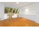 Minimalist living room with parquet floors, built-in cabinets, and natural light at 165 River North Walk, Atlanta, GA 30328
