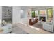 Inviting living room featuring a fireplace, and built-in bookshelves at 165 River North Walk, Atlanta, GA 30328