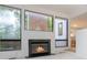 Bright living room featuring a fireplace, large windows, and modern architectural design at 165 River North Walk, Atlanta, GA 30328