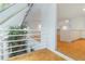 Open living space with a skylight, white railing, and hardwood floors at 165 River North Walk, Atlanta, GA 30328