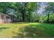 Well maintained and massive backyard with mature trees and level lot perfect for outdoor activities at 1906 Oak Valley Rd, Decatur, GA 30035