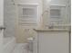 Bathroom with a granite countertop, white cabinetry, tiled floors, and a tub with tiled surround at 1906 Oak Valley Rd, Decatur, GA 30035