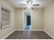 Clean room with gray vinyl floors, fresh paint, natural light, and a ceiling fan at 1906 Oak Valley Rd, Decatur, GA 30035