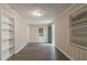 Bright room with new gray vinyl flooring, fresh paint, built-in shelves, and natural light at 1906 Oak Valley Rd, Decatur, GA 30035