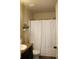 Bathroom featuring shower with full curtain, granite countertop and fixtures at 237 Arborview Dr, Mcdonough, GA 30252